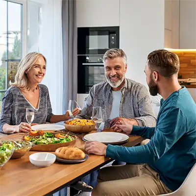 Family enjoying a meal celebrating rehab of their son.