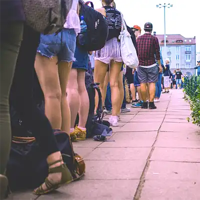 People in a line waiting for addiction rehab.