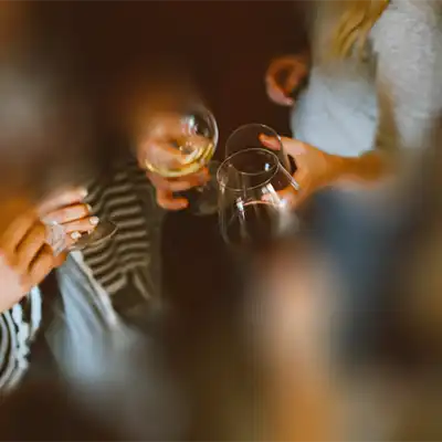  Fuzzy picture of people drinking wine.