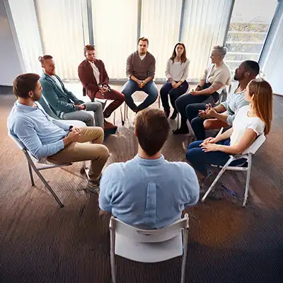  group of people in addiction counselling.