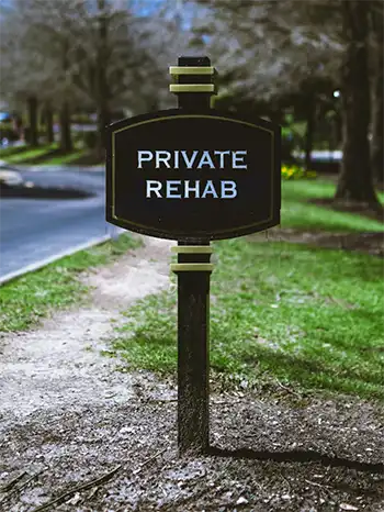 A sign for a private rehab.